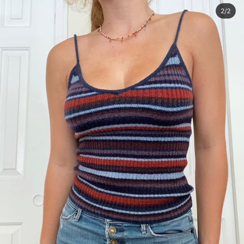 Super cute tank top, says small but can fit medium